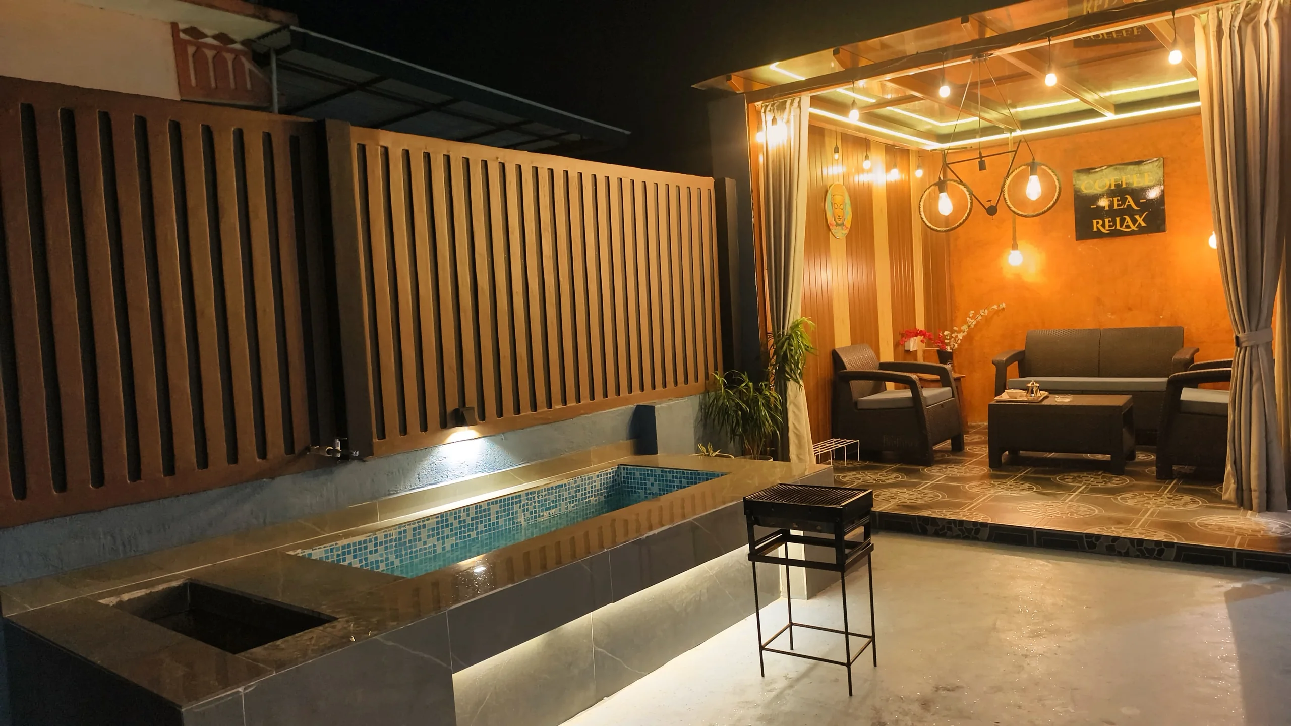 Heated rooftop plunge pool and pergola sky lounge at night, Omnia Luxe Villa, Damak