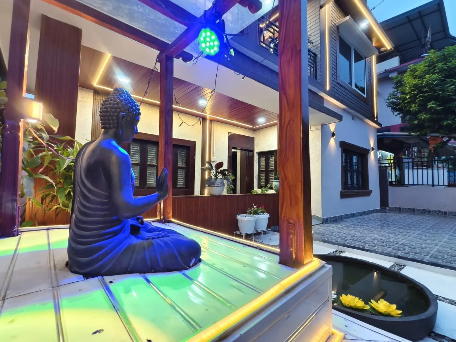 Buddha statue pavilion in the garden at dusk