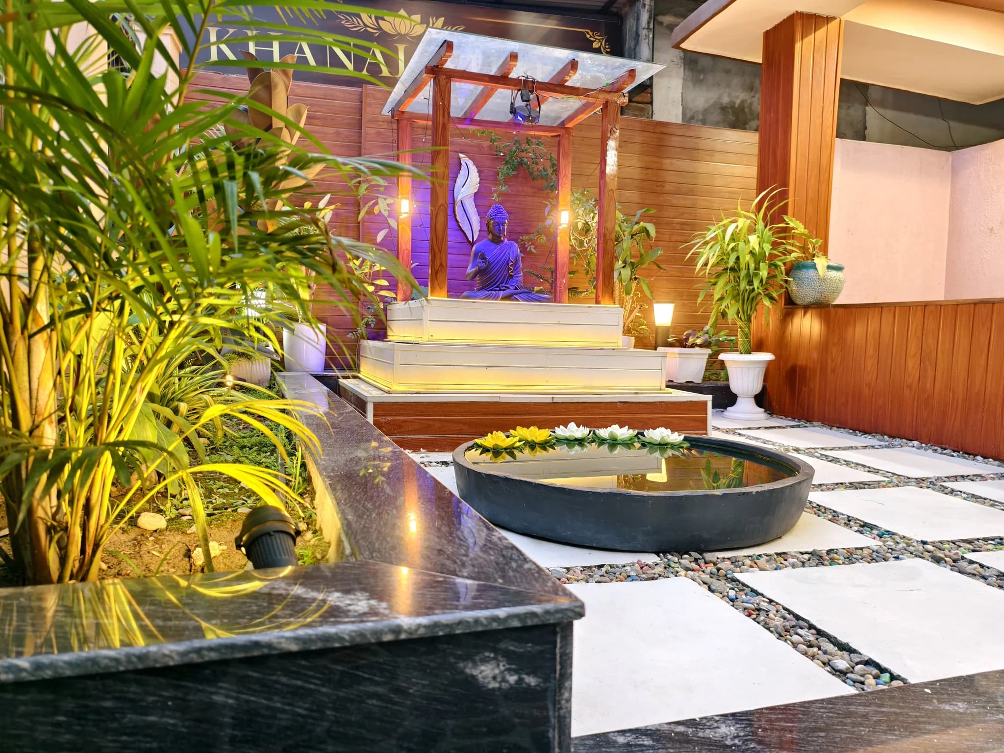 Zen garden at Omnia Luxe Villa with Buddha shrine and lotus pond
