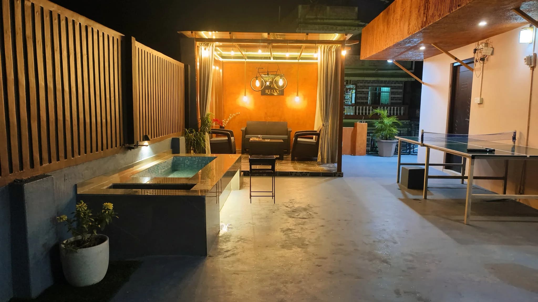 Pergola seating area on the rooftop sky lounge at Omnia Luxe Villa